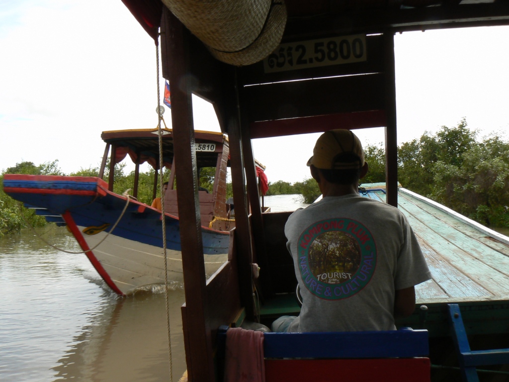 The lake is filling but not full - so the boat trip is dwn a narrow channel/river through the rice fields and scrub.