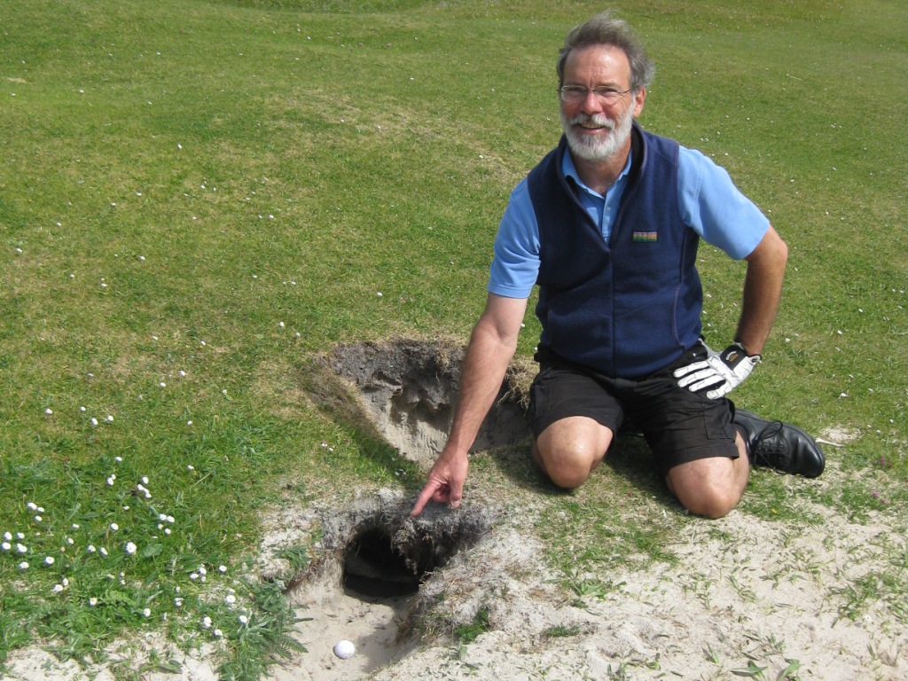 Rule 25 clearly allows for a free drop when your ball lies in a hole made by a burrowing animal - thank heavens.